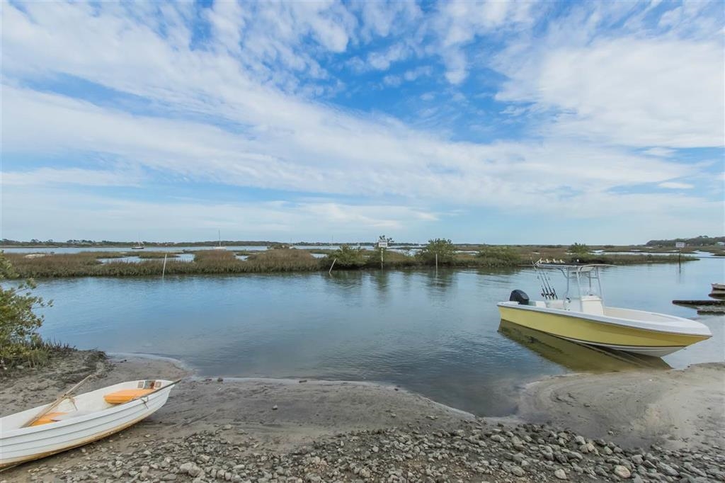802 Royal Road St. Augustine, FL 32086 - Photo 35 of 47 a view of a lake with houses in the back
