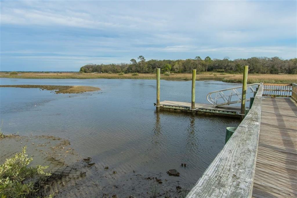 802 Royal Road St. Augustine, FL 32086 - Photo 39 of 47 a view of a lake with boats and trees in the background