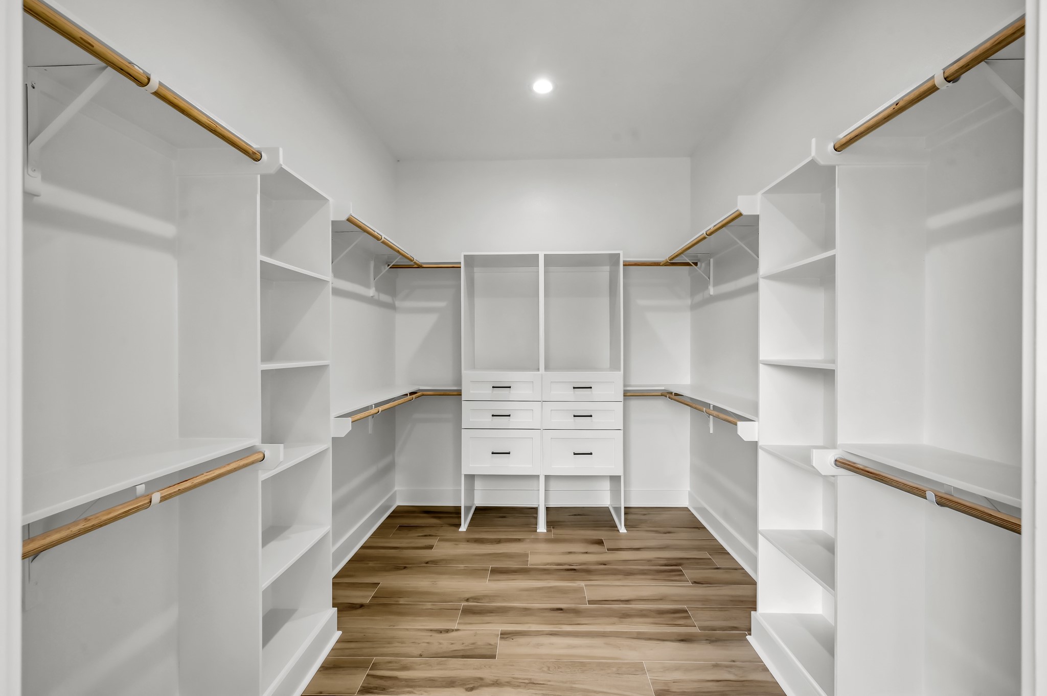 14742 Turquoise Trail Willis, TX 77378 - Photo 28 of 48 Large custom walk-in closet with built-in shelving, hanging space, and drawer storage designed for maximum organization and convenience.