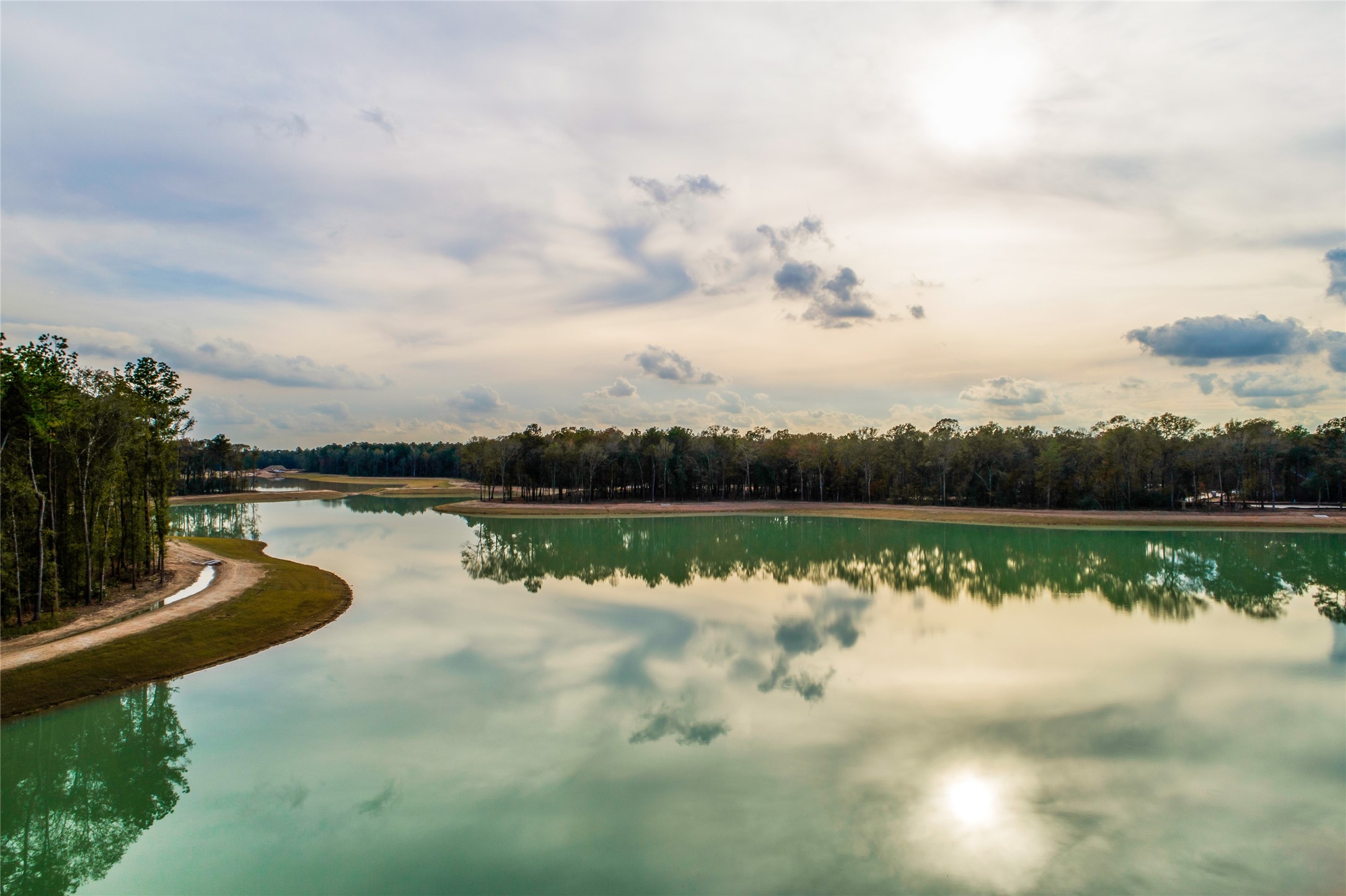 9422 Pacific Crest Porter, TX 77365 - Photo 23 of 26 a view of a lake with a yard