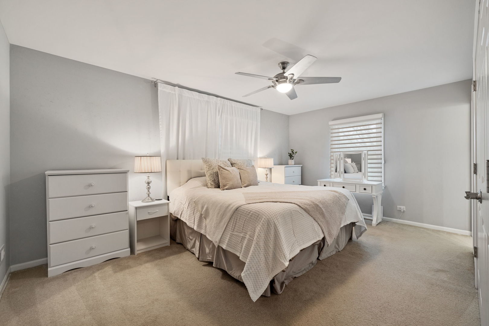 1635 Orth Drive Wheaton, IL 60189 - Photo 13 of 36 a spacious bedroom with a bed and a chandelier