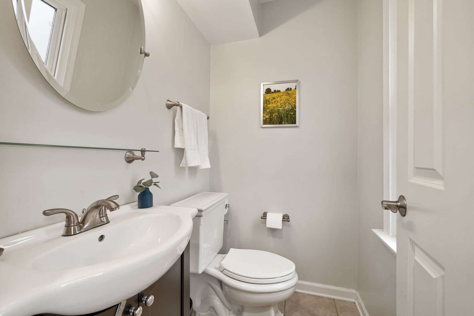 1635 Orth Drive Wheaton, IL 60189 - Photo 18 of 36 a bathroom with a toilet a sink and mirror