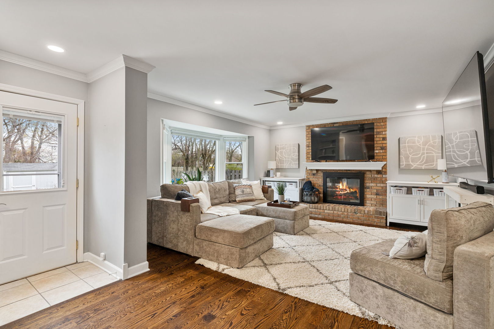 1635 Orth Drive Wheaton, IL 60189 - Photo 19 of 36 a living room with fireplace furniture and a flat screen tv
