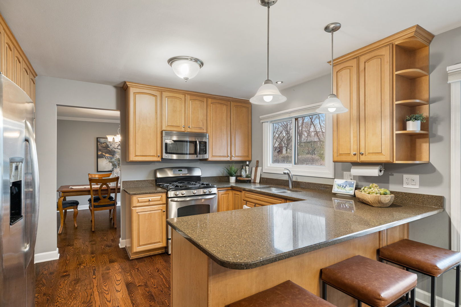 1635 Orth Drive Wheaton, IL 60189 - Photo 24 of 36 a kitchen with stainless steel appliances granite countertop a sink a stove and refrigerator