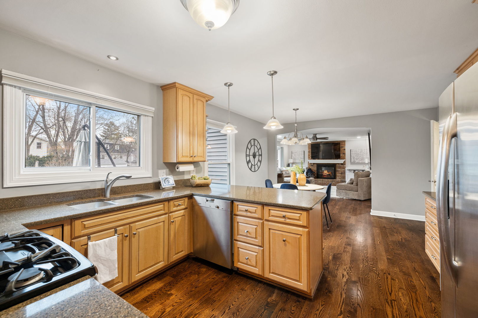 1635 Orth Drive Wheaton, IL 60189 - Photo 25 of 36 a kitchen with a sink stove and wooden floor