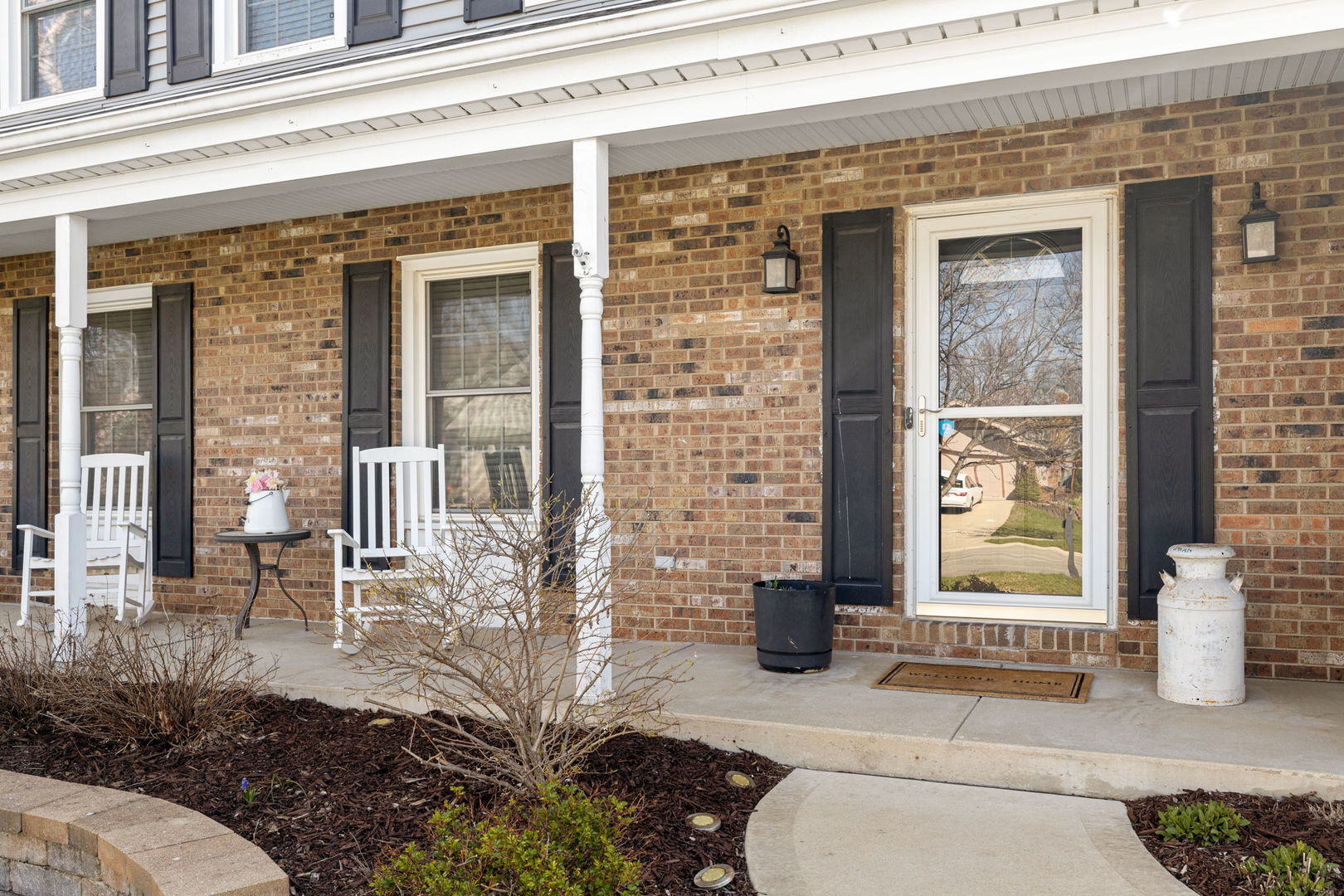 1635 Orth Drive Wheaton, IL 60189 - Photo 8 of 36 a front view of a house with a garden