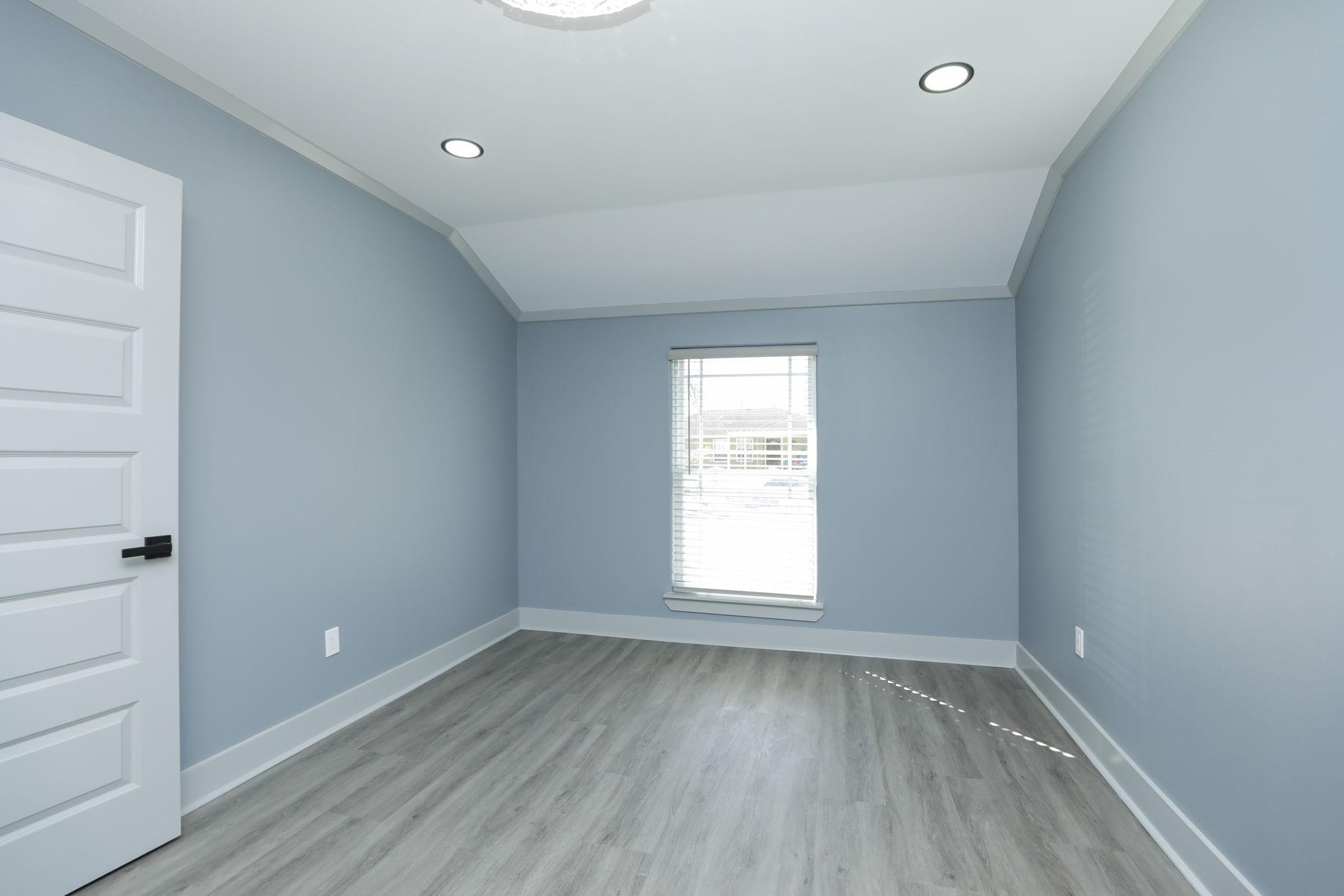 4047 Juliet Street Houston, TX 77087 - Photo 25 of 38 an empty room with wooden floor and window