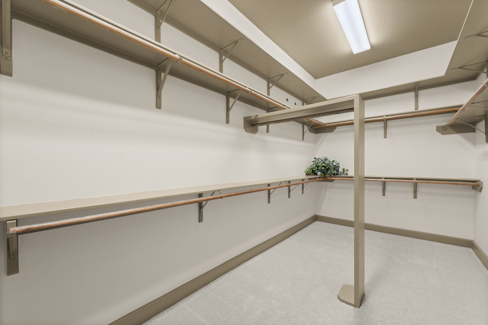 1534 Virgie Community Road Magnolia, TX 77354 - Photo 31 of 50 The primary closet has amazing storage and a separation that helps each person have their own space.