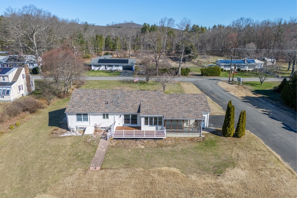 282 Loudville Road, Unit 1 Easthampton, MA 01027 - Photo 34 of 40 a view of a house with a yard and sitting area