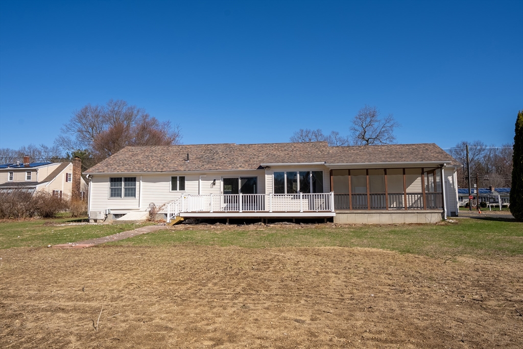 282 Loudville Road, Unit 1 Easthampton, MA 01027 - Photo 37 of 40 a view of a big house with a big yard and a large tree