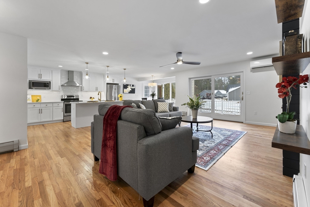 282 Loudville Road, Unit 1 Easthampton, MA 01027 - Photo 6 of 40 a living room with furniture and a flat screen tv