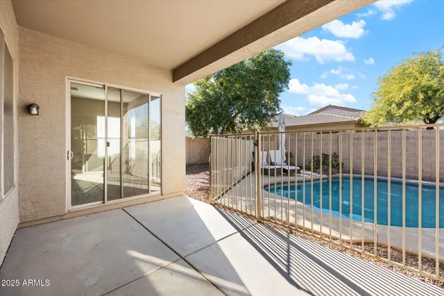 a balcony with yard and wooden floor