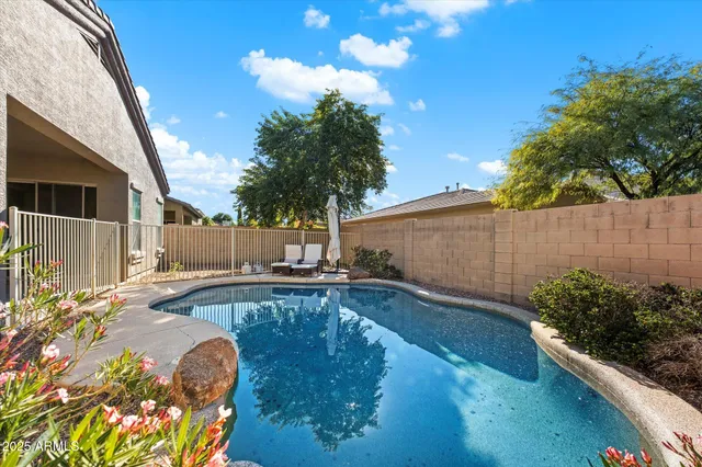 a view of a backyard with plants and a patio