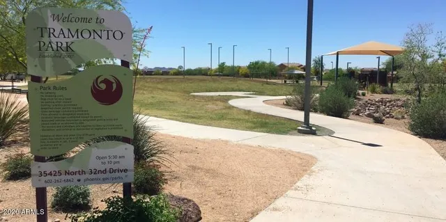 a view of a street with a park