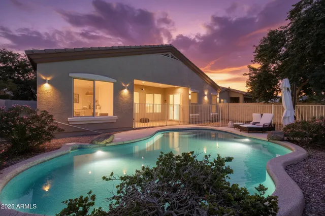 a view of a swimming pool with an outdoor space and seating area