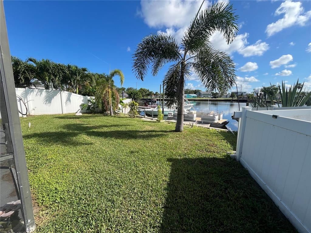 13630 Lagoon Drive Hudson, FL 34667 - Photo 18 of 26 a view of a golf course with a house