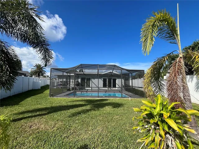 a view of a back yard of the house