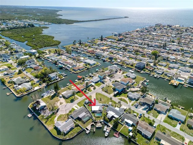 an aerial view of a house with outdoor space