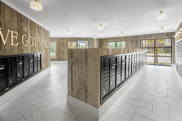 a kitchen with stainless steel appliances kitchen island granite countertop a stove a sink a refrigerator a center island a stove and a cabinets