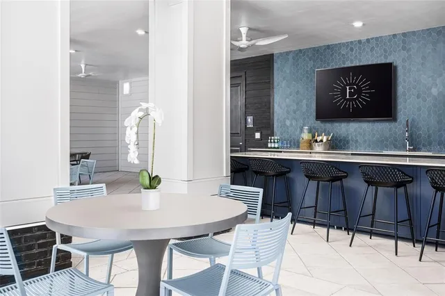 a kitchen with a table and chairs in it