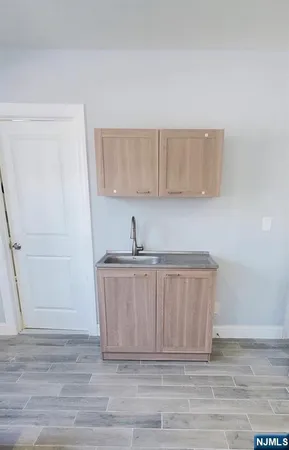 a kitchen with a sink and cabinets