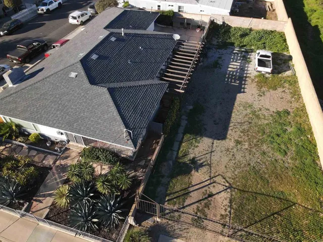 an aerial view of house with yard