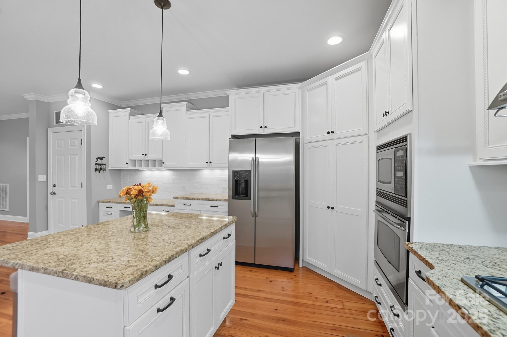 1651 Scotch Pine Lane Tega Cay, SC 29708 - Photo 17 of 48 a kitchen with stainless steel appliances granite countertop a refrigerator a sink and a stove