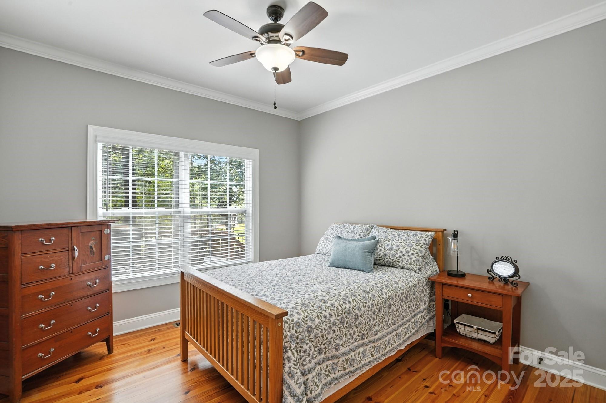 1651 Scotch Pine Lane Tega Cay, SC 29708 - Photo 22 of 48 a bedroom with a bed and a dresser