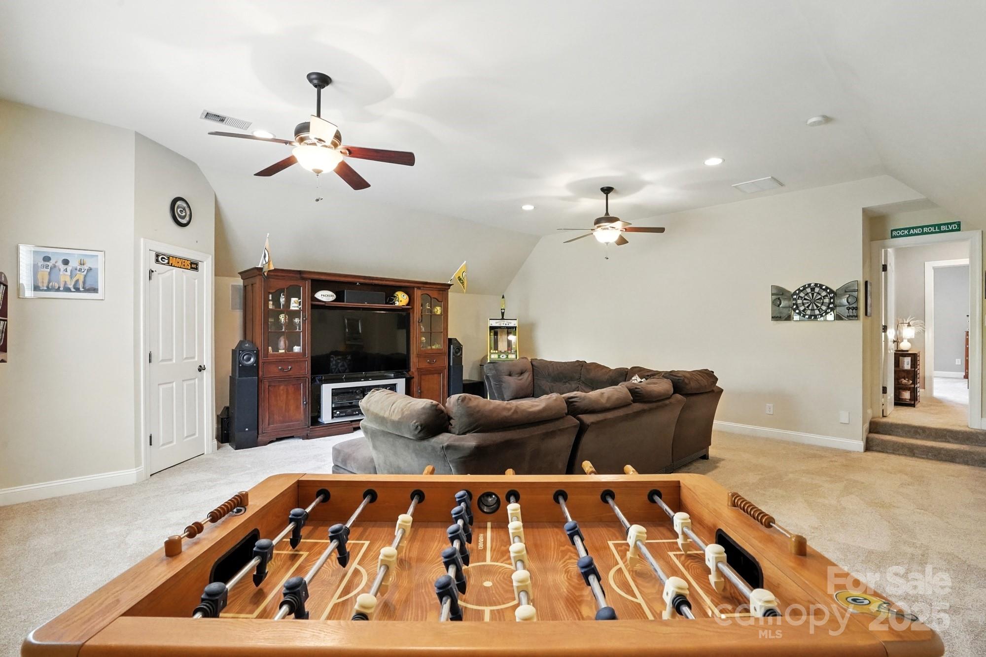 1651 Scotch Pine Lane Tega Cay, SC 29708 - Photo 29 of 48 a living room with furniture and a flat screen tv
