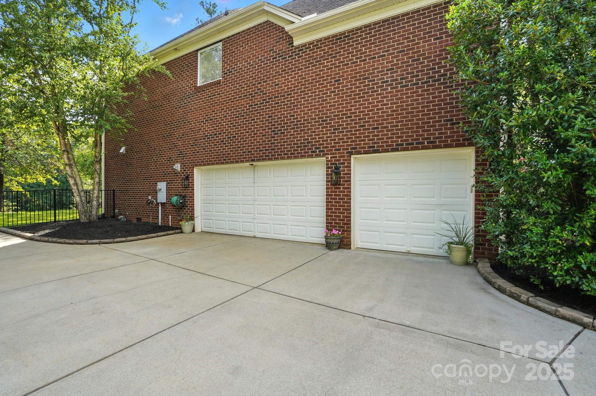 1651 Scotch Pine Lane Tega Cay, SC 29708 - Photo 5 of 48 a front view of a house with a garage