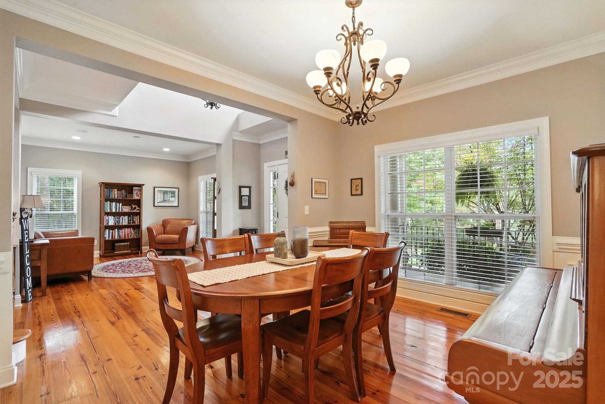 1651 Scotch Pine Lane Tega Cay, SC 29708 - Photo 10 of 48 a view of a dining room with furniture window and outside view