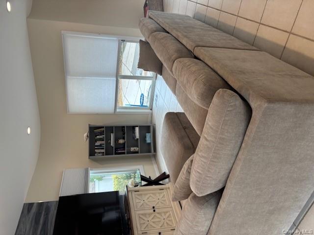 54 Matlock Street Long Beach, NY 11561 - Photo 10 of 22 a living room with furniture and a flat screen tv