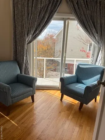 a living room with couches and a flat screen tv