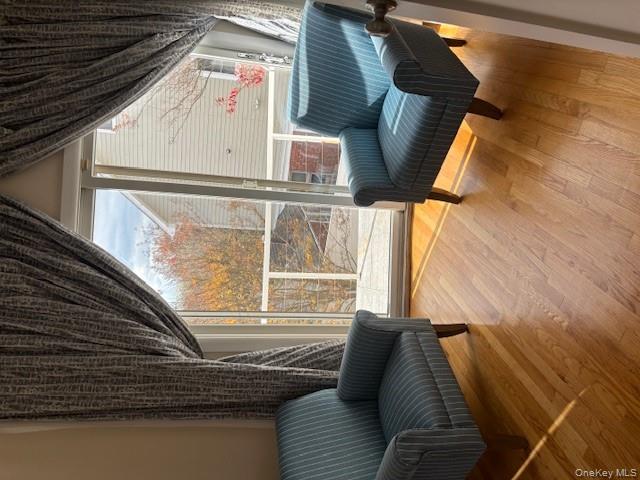 54 Matlock Street Long Beach, NY 11561 - Photo 16 of 22 a living room with furniture and a large window