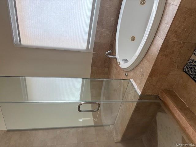 54 Matlock Street Long Beach, NY 11561 - Photo 17 of 22 a bath tub sitting next to a bathroom sink