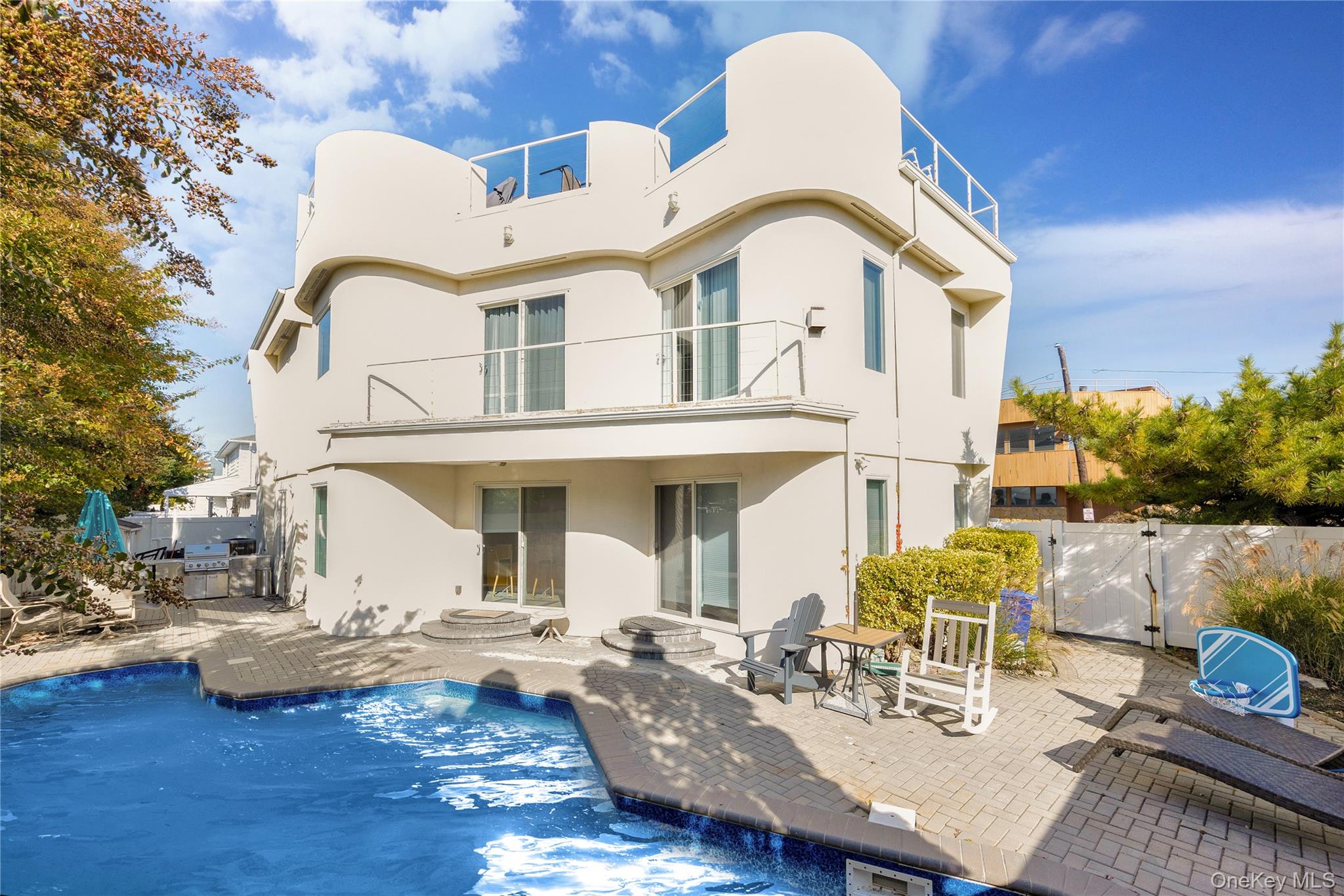 54 Matlock Street Long Beach, NY 11561 - Photo 2 of 22 a view of pool table and chairs in patio