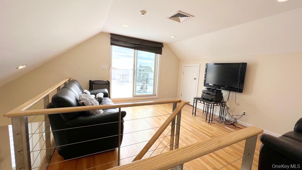 54 Matlock Street Long Beach, NY 11561 - Photo 5 of 22 a living room with furniture and a flat screen tv