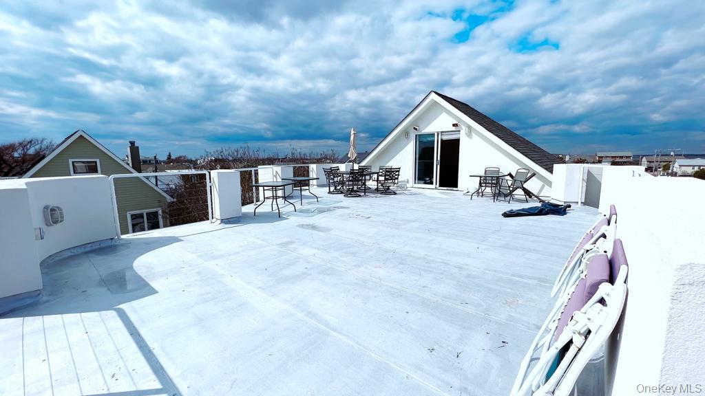 54 Matlock Street Long Beach, NY 11561 - Photo 6 of 22 a view of a house with a patio