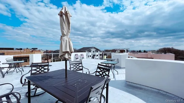 a view of a terrace with furniture