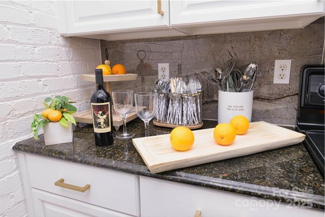 a bathroom with a granite countertop sink and a blue