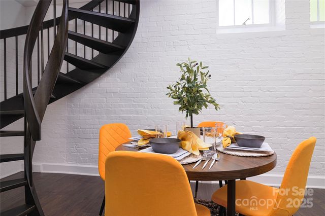 a view of a balcony with table and chairs