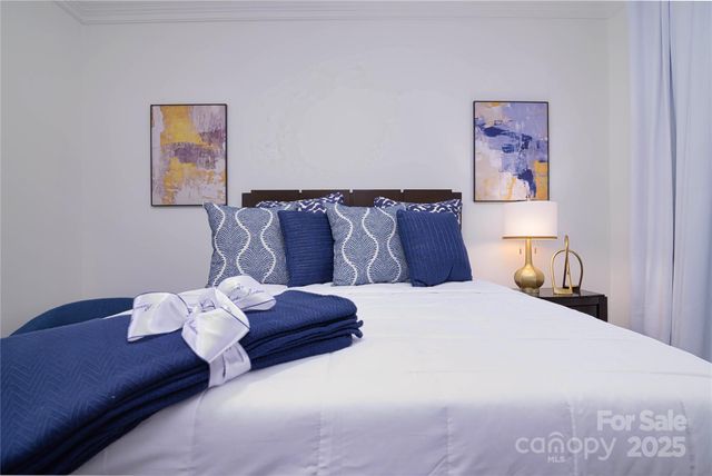 a bedroom with a bed and a couch