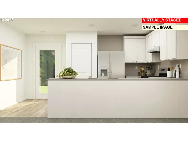 a kitchen with kitchen island stainless steel appliances a sink a refrigerator and a window