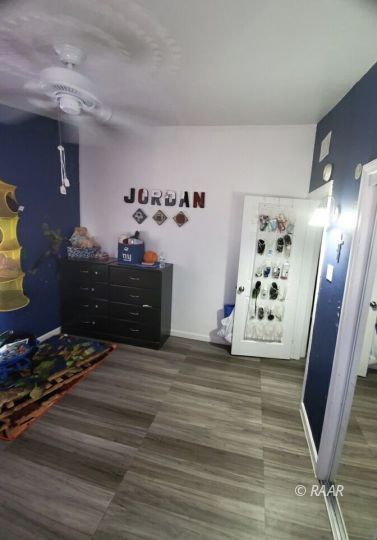 425 North Norma Street Ridgecrest, CA 93555 - Photo 12 of 33 a view of a livingroom with wooden floor