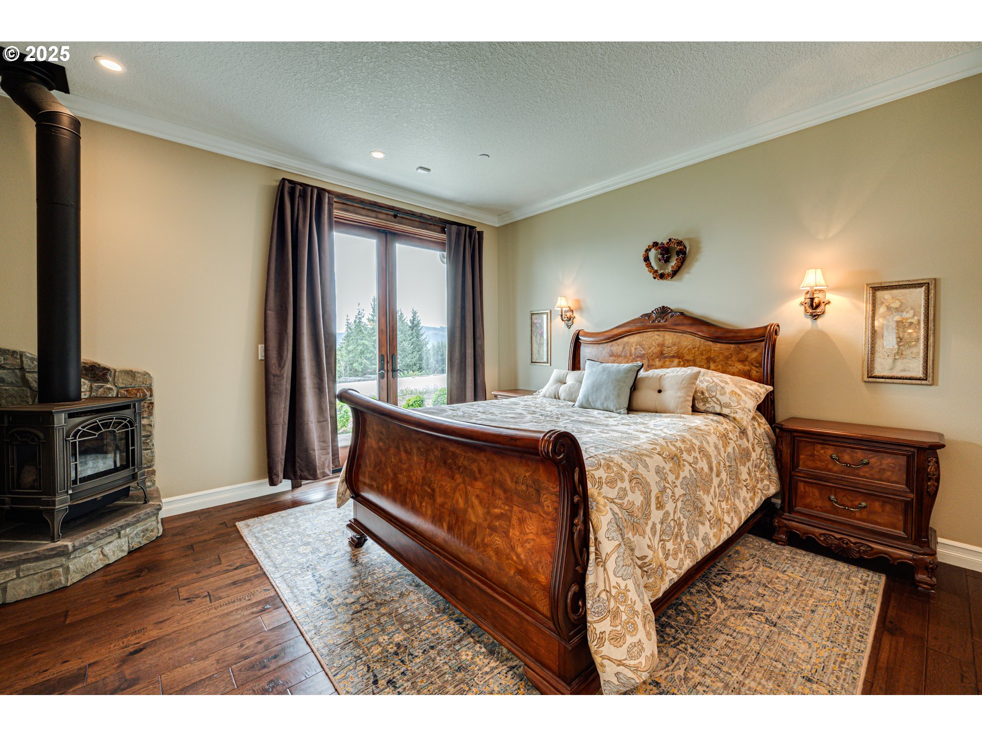 421 Woodland Heights Road Woodland, WA 98674 - Photo 12 of 48 a bedroom with a bed and a flat tv screen on dresser