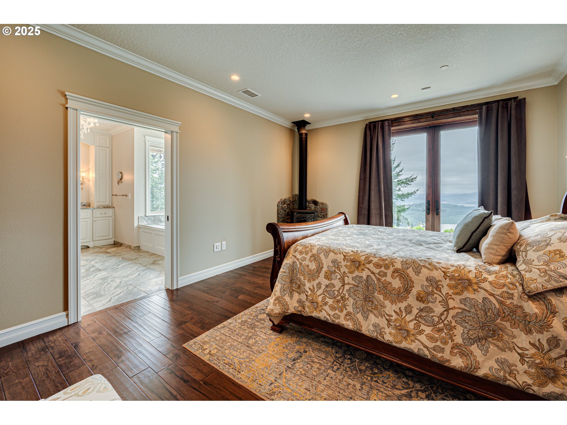 421 Woodland Heights Road Woodland, WA 98674 - Photo 13 of 48 a bed sitting in a spacious bedroom next to a window