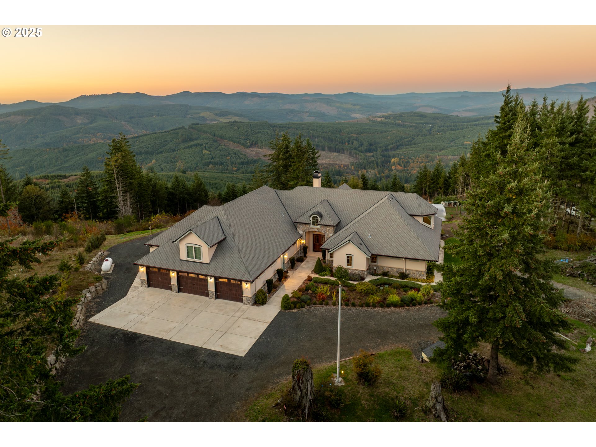 421 Woodland Heights Road Woodland, WA 98674 - Photo 2 of 48 a view of a house with a mountain in the background