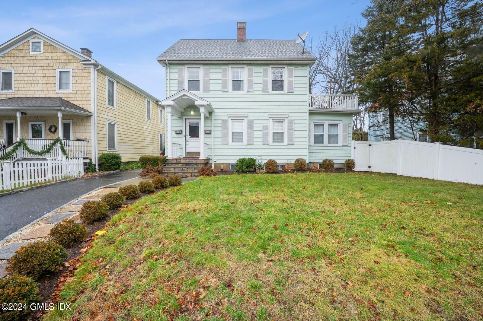 119 Halstead Avenue, Unit 2 Greenwich, CT 06831 - Photo 1 of 29 a front view of a house with a yard