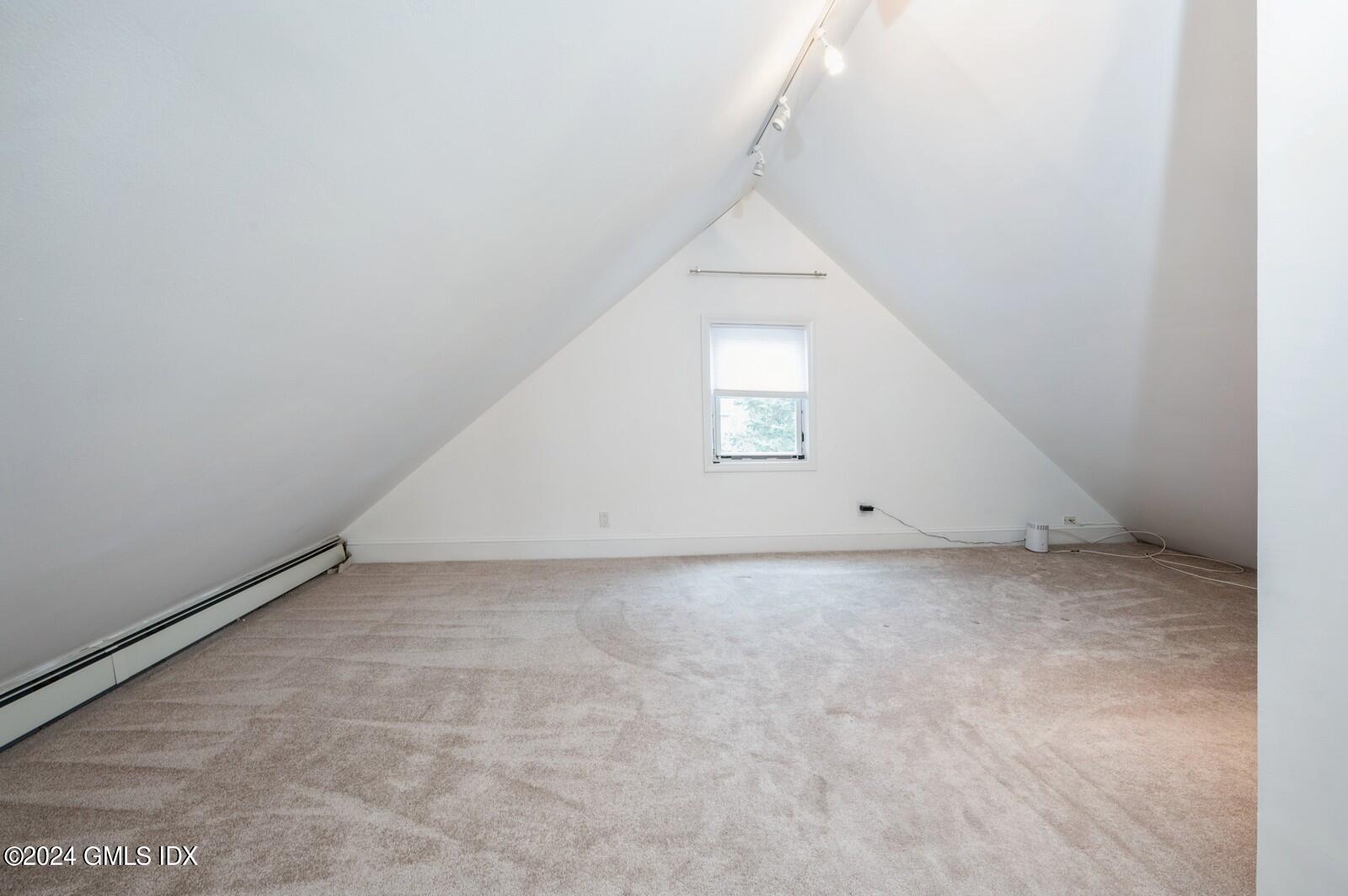 119 Halstead Avenue, Unit 2 Greenwich, CT 06831 - Photo 22 of 29 an empty room with a staircase