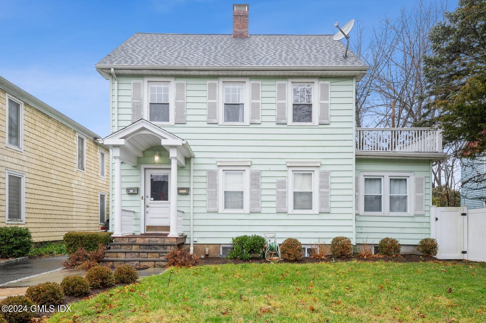 119 Halstead Avenue, Unit 2 Greenwich, CT 06831 - Photo 27 of 29 a front view of a house with a yard